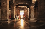The entrance of an ancient temple glowing warmly in the evening light.