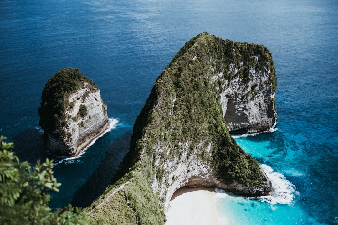 black rock formation on blue sea water during daytime