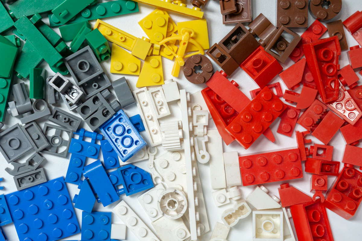 Blue, red, and yellow brick pieces on white