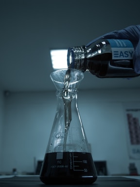 clear glass bottle on white table