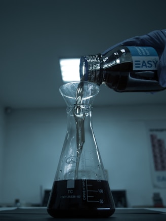 clear glass bottle on white table