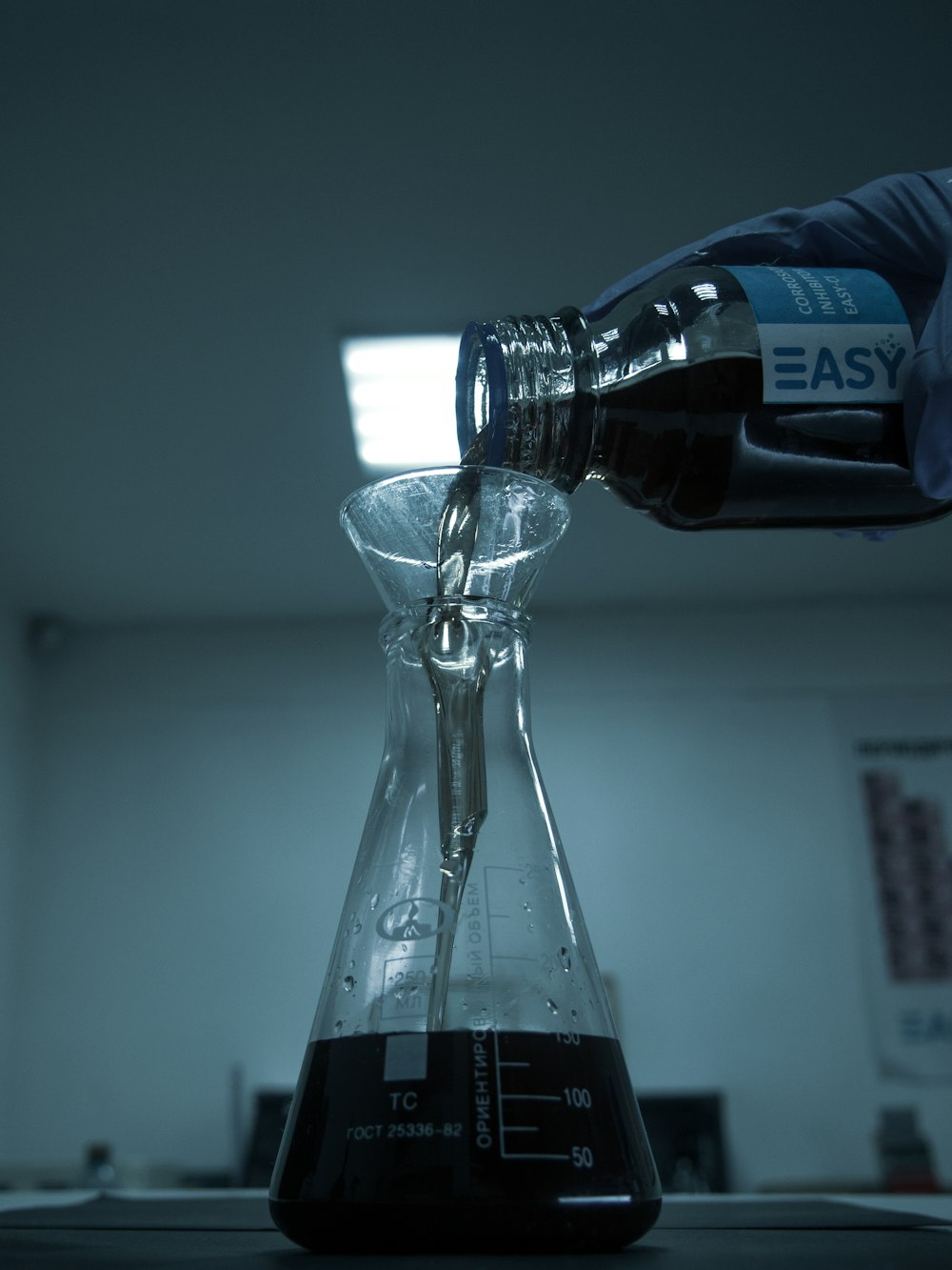 clear glass bottle on white table