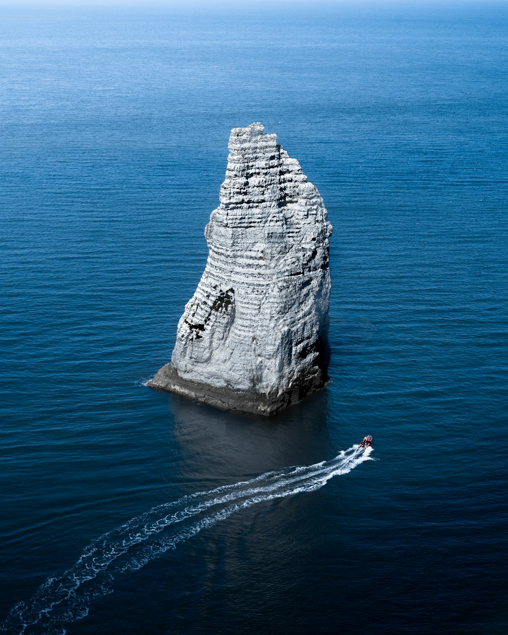 gray rock formation on sea during daytime