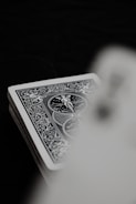 Detailed shot of game cards with minimalist typography and iconography.