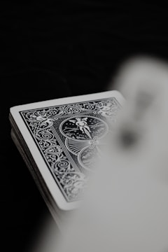 Detailed shot of game cards with minimalist typography and iconography.