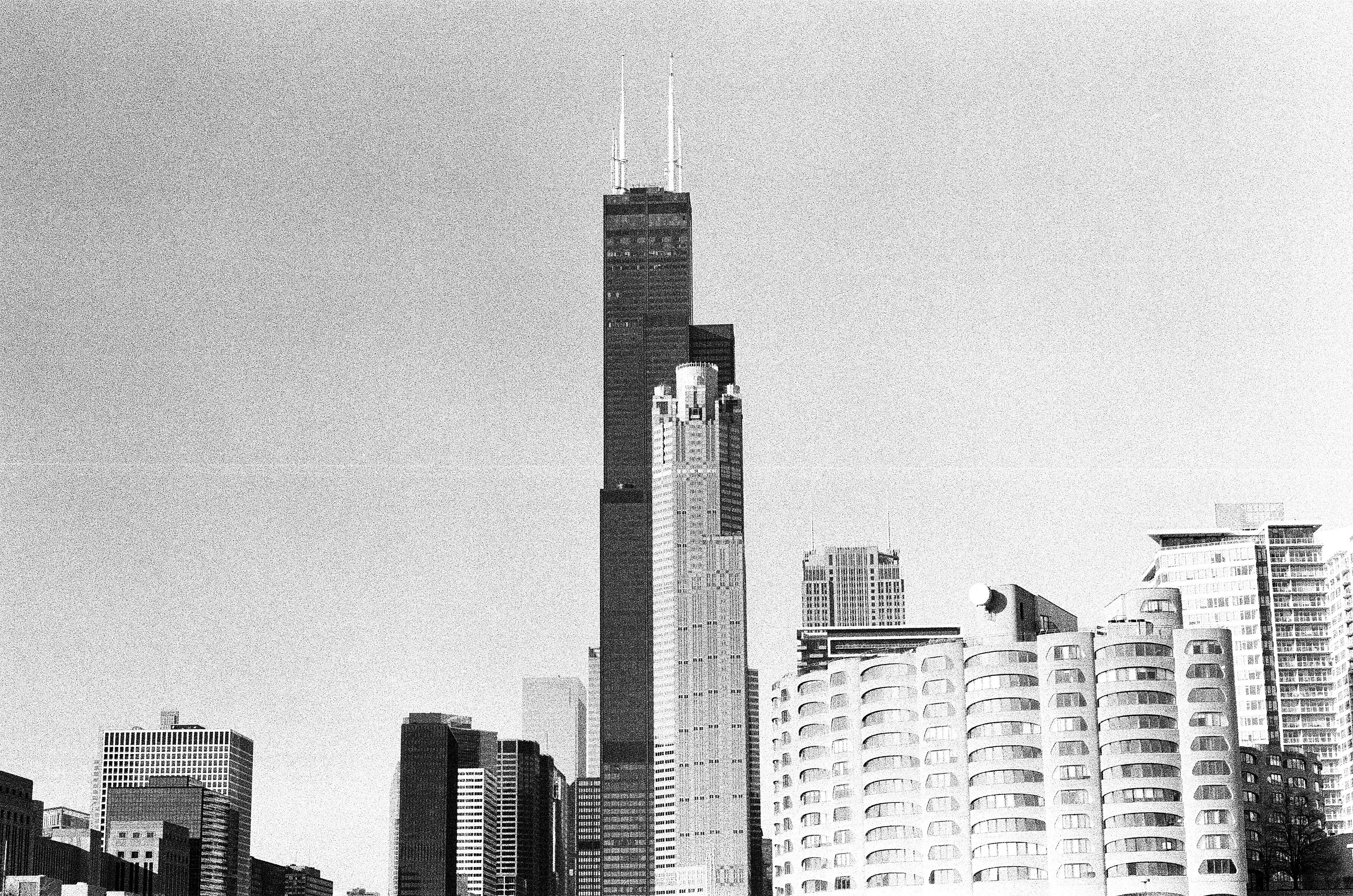 grayscale photo of city buildings