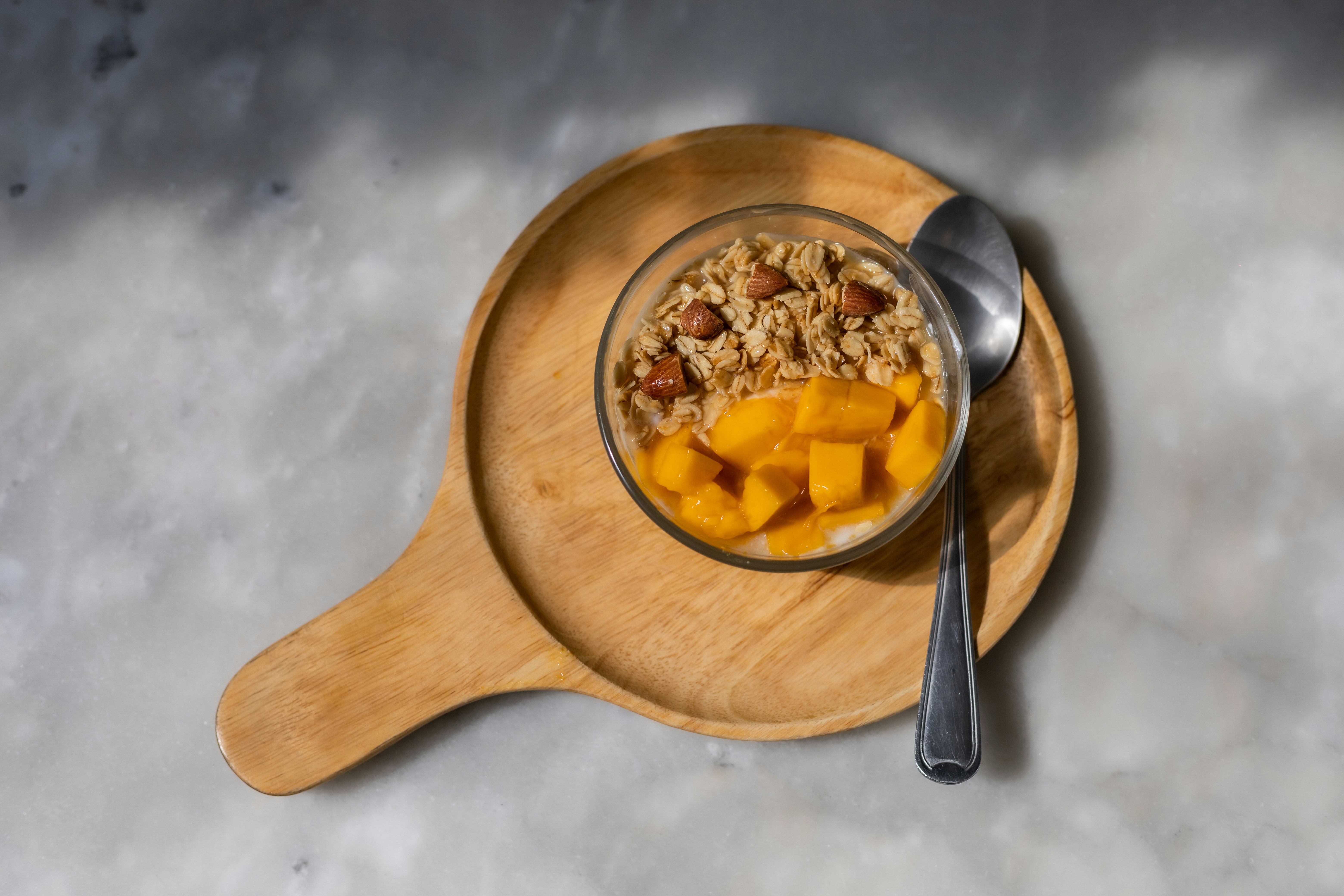 brown wooden bowl with food