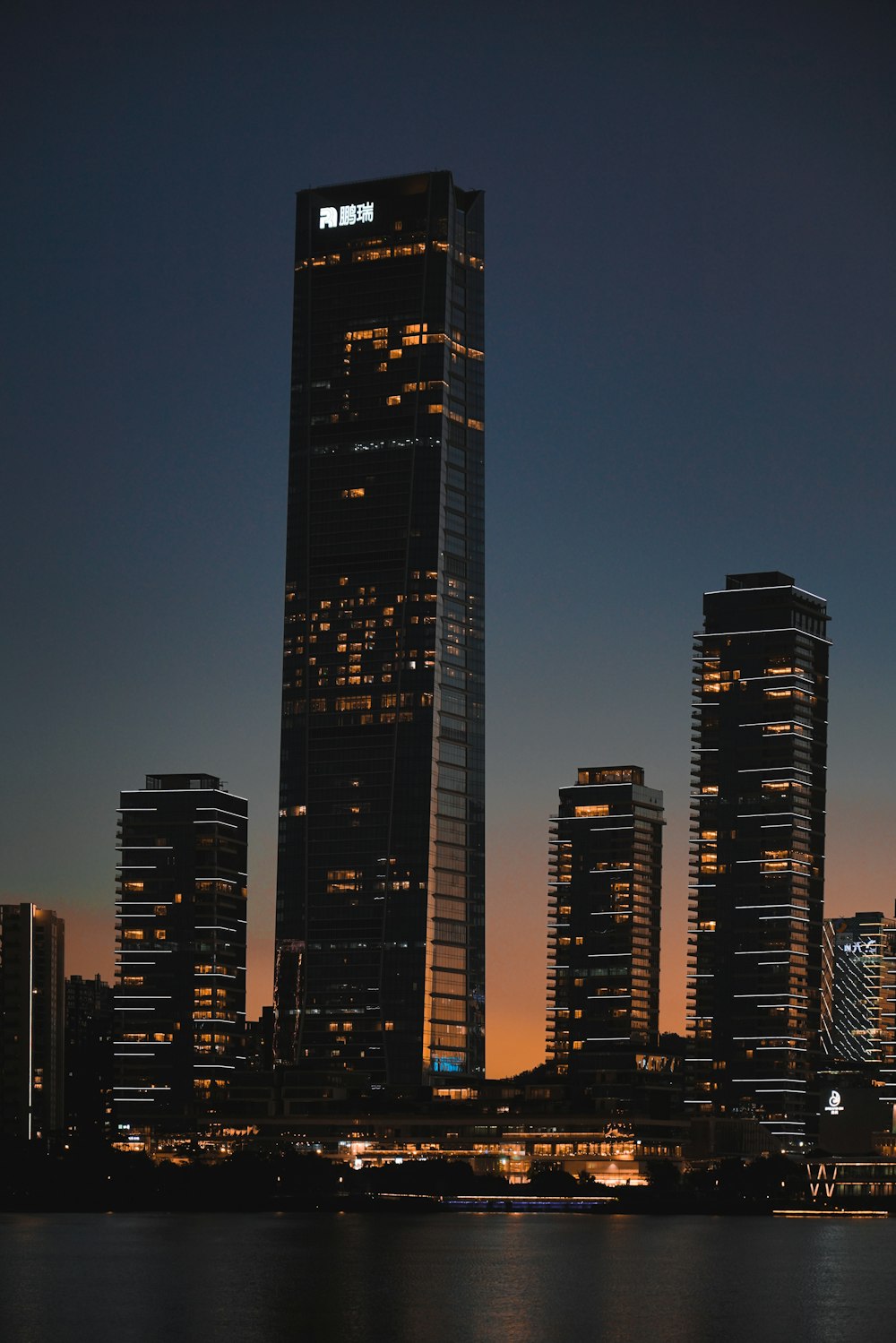 black high rise building during night time