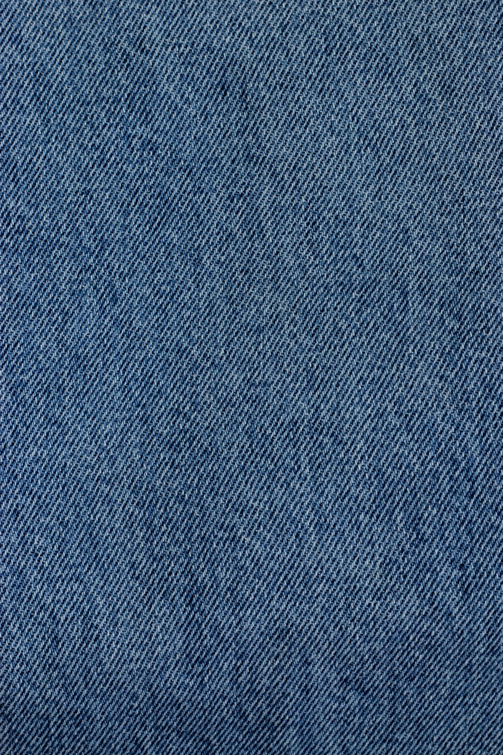 A close up of a blue jean fabric photo – Free Denim Image on Unsplash