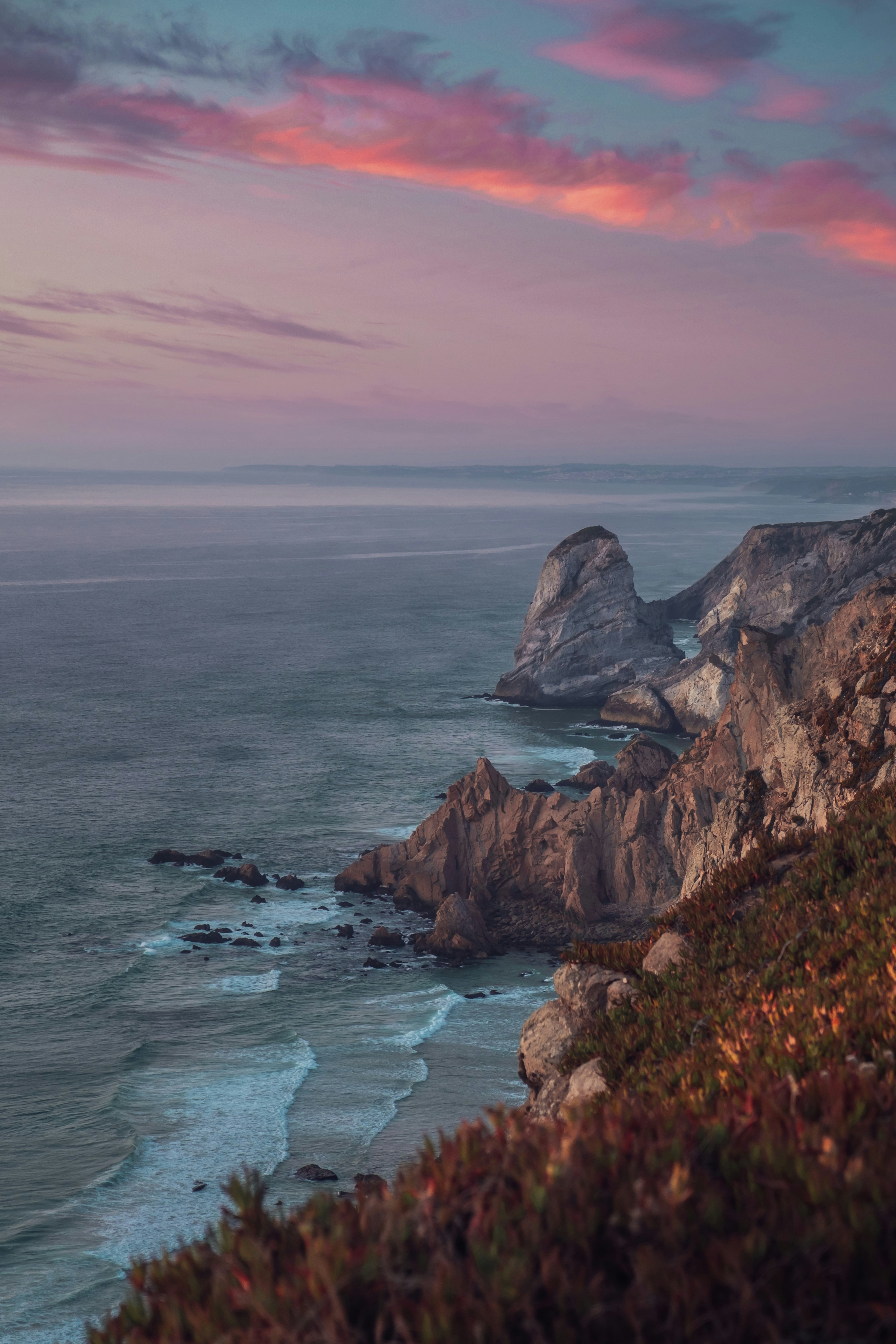 brown rock formation on sea during daytime