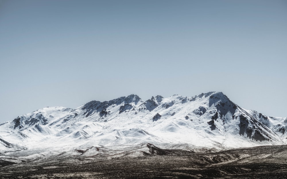 snow covered mountain under blue sky during daytime