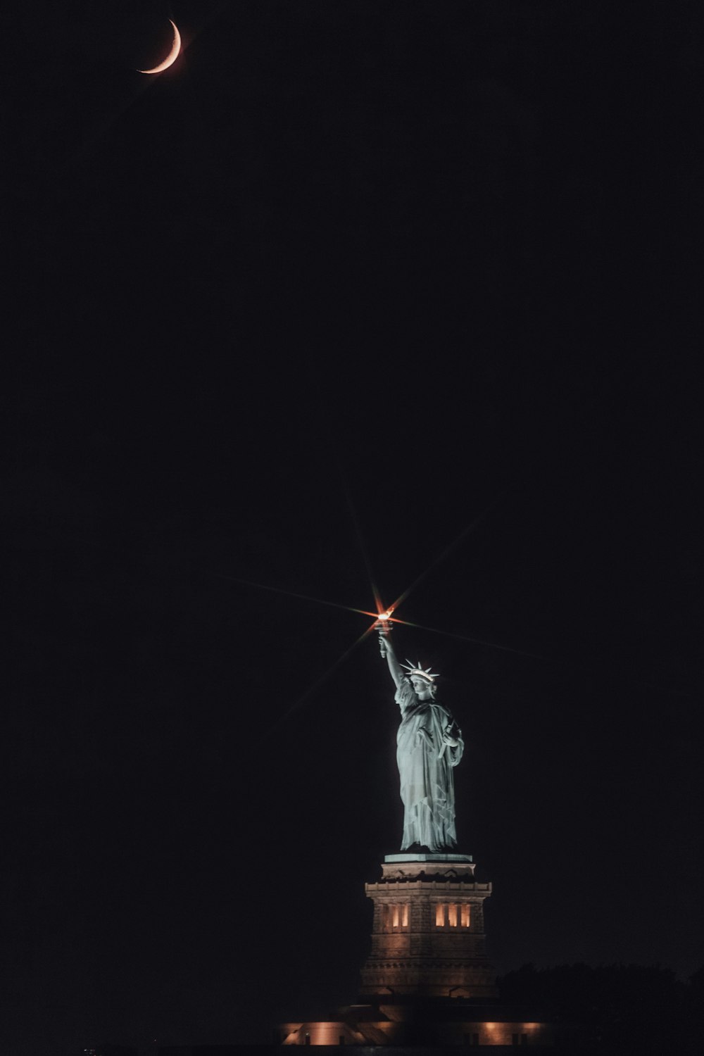 statue of liberty during night time