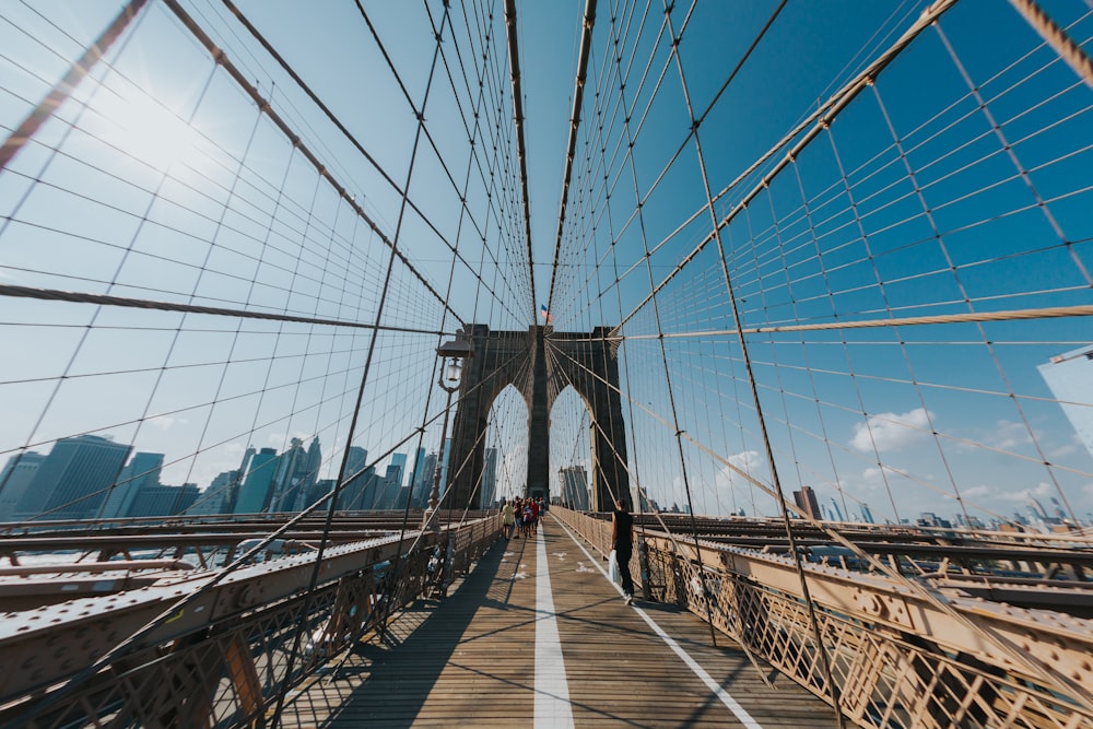 people walking on bridge during daytime