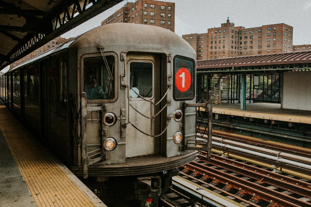 gray train on rail during daytime