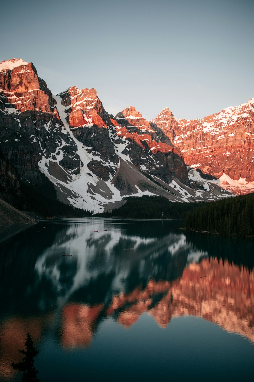 lake near snow covered mountain