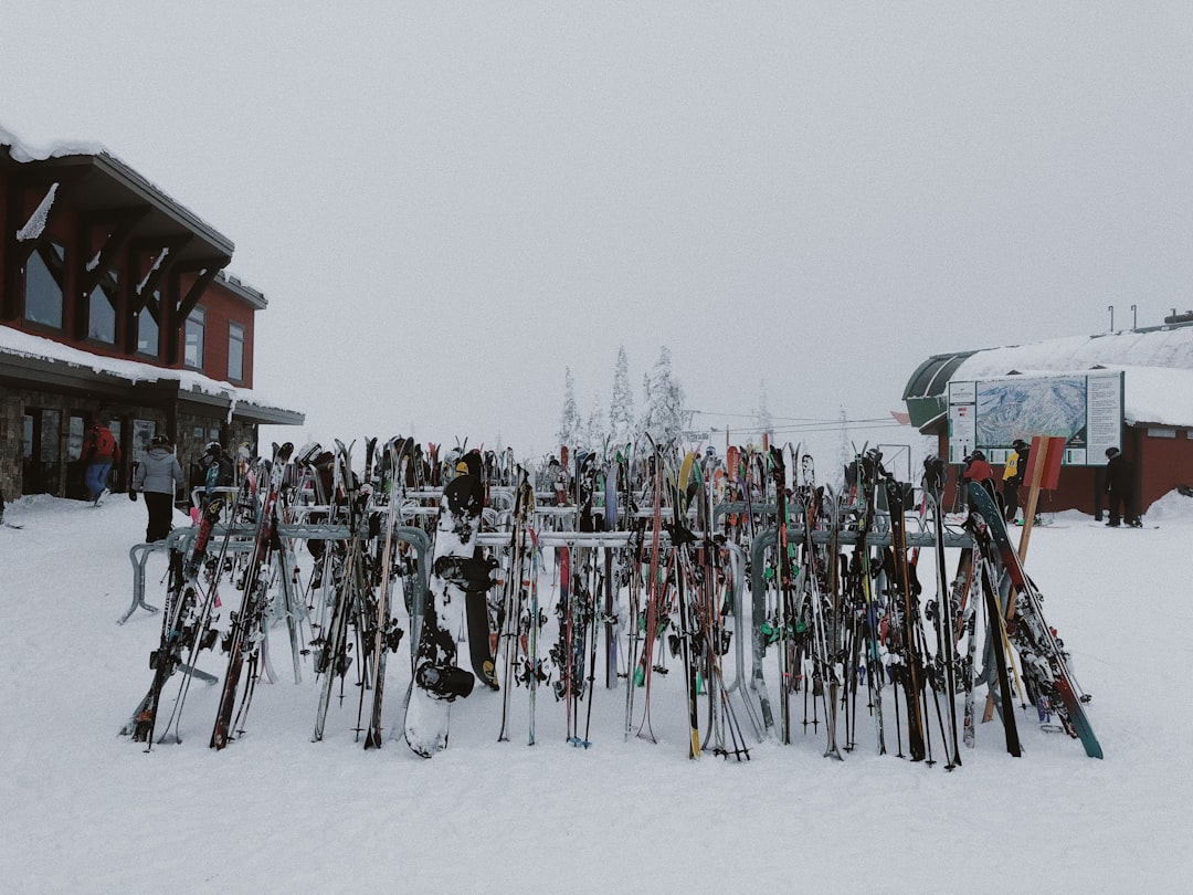 people riding ski blades on snow covered ground during daytime