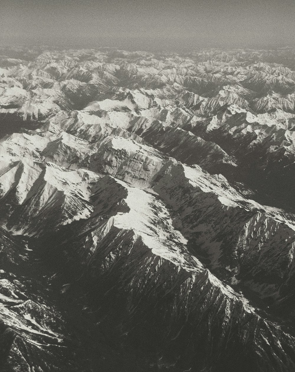 black and white mountains under white sky during daytime