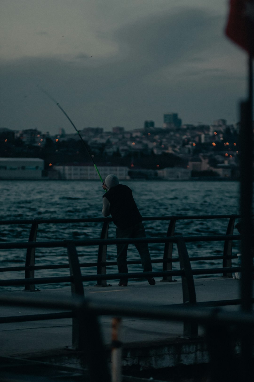 person fishing on the sea during daytime