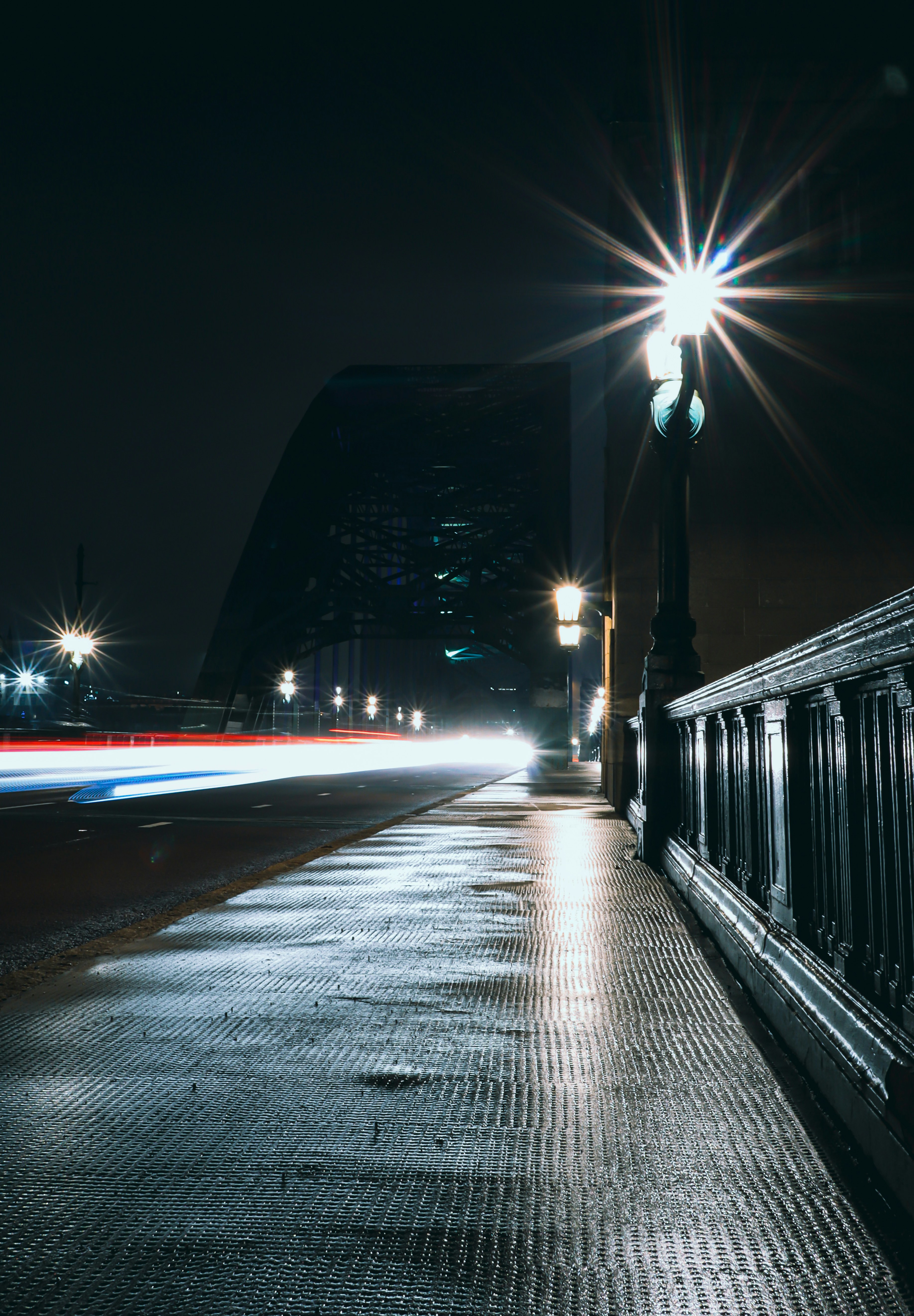black and white bridge during night time