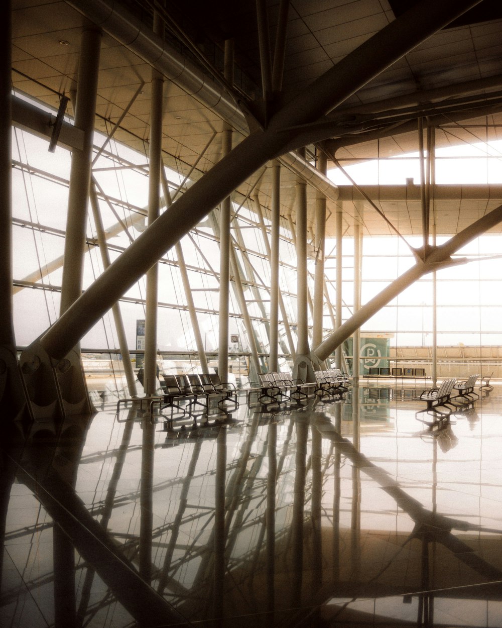 people in a building with glass walls