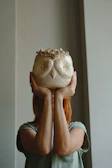 Close-up of a handmade ceramic vase displayed by a proud customer