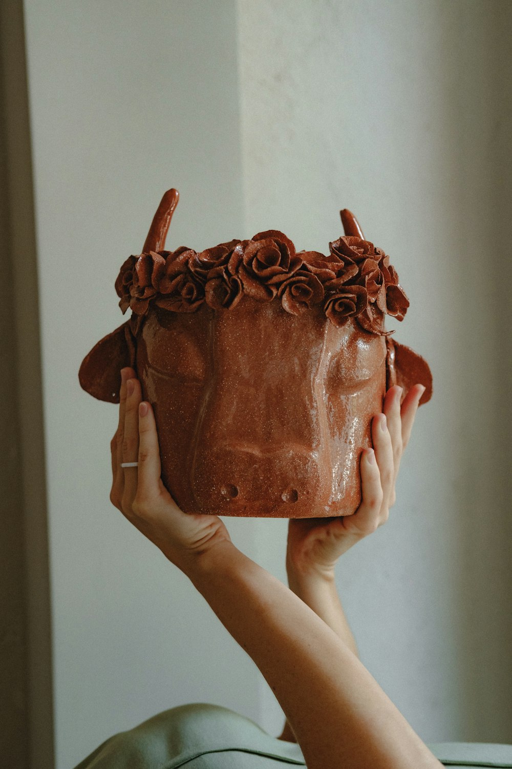 person holding brown leather bag