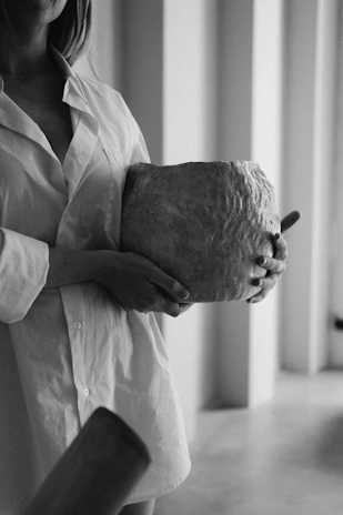 A client uploading photos of stone blocks via a secure login interface on a tablet.