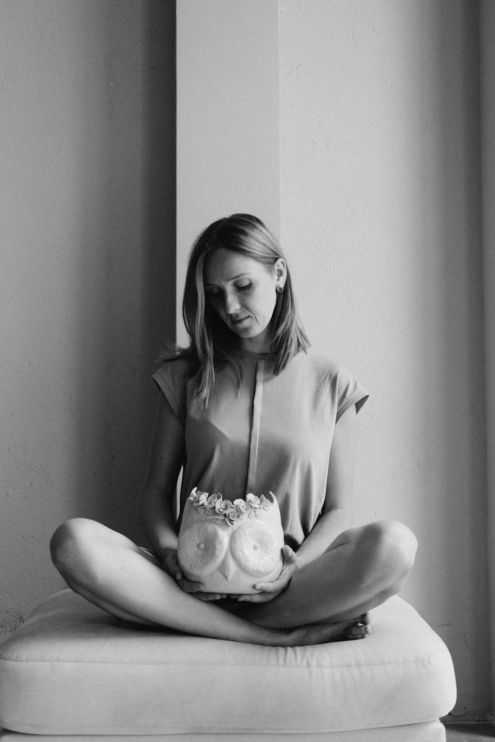 woman in white tank top holding baby