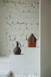 brown wooden bird house on white wooden table