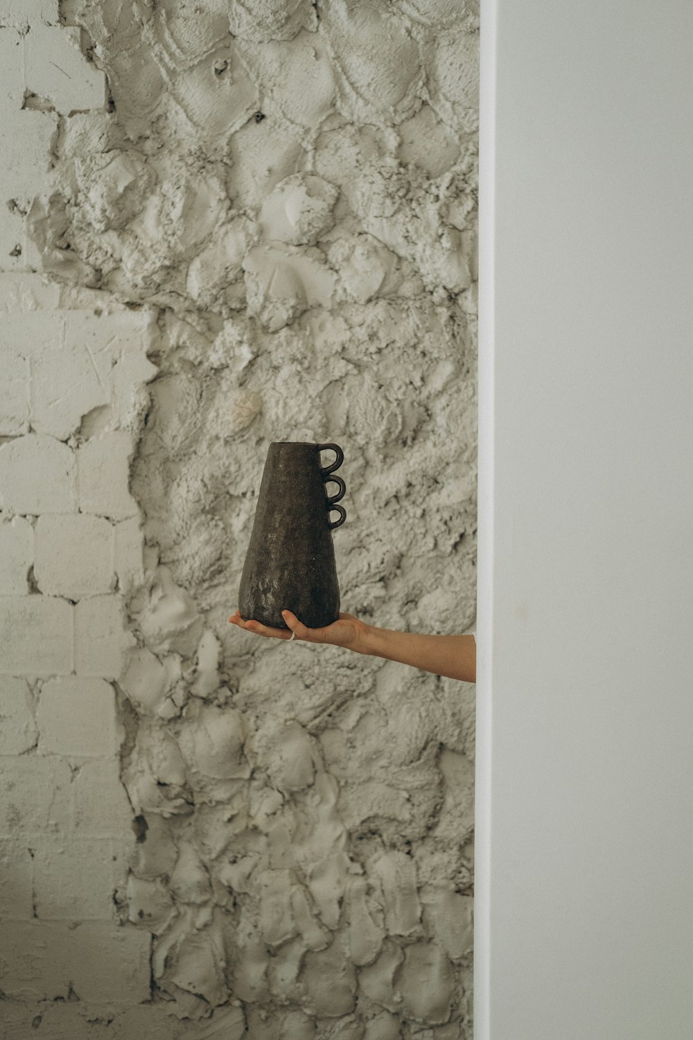 person holding black ceramic mug