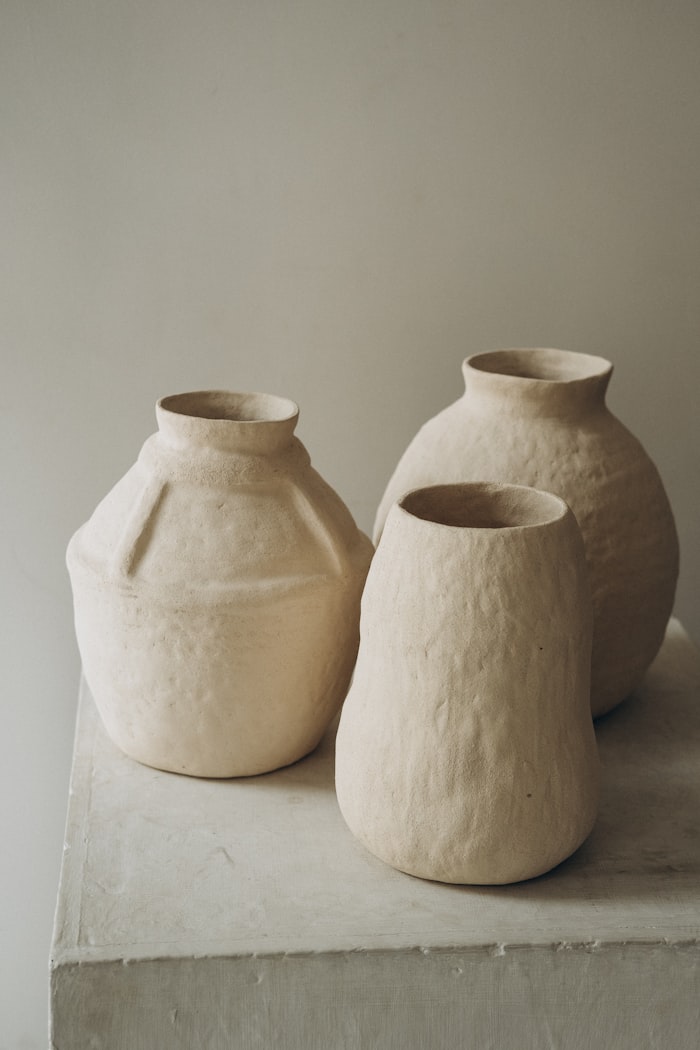 White ceramic jars by Yana Hurska on Unsplash