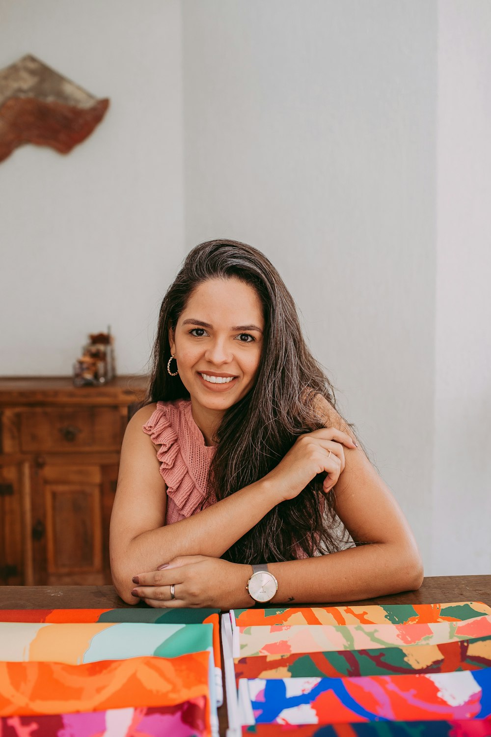 woman in red tank top sitting on chair