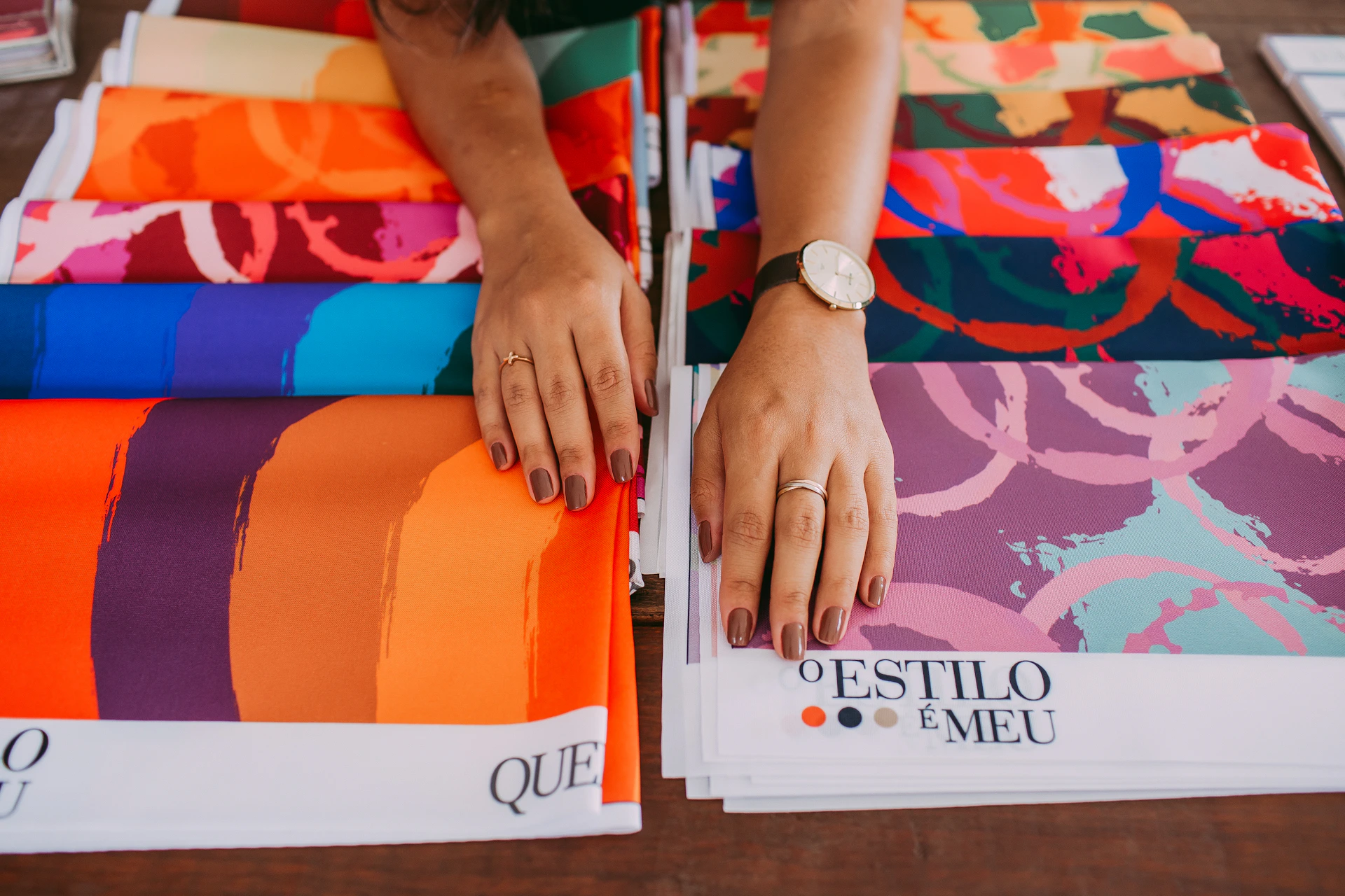 person holding orange and white box