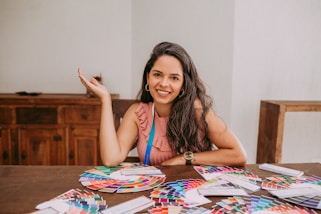 woman in blue and white tank top sitting on chair
