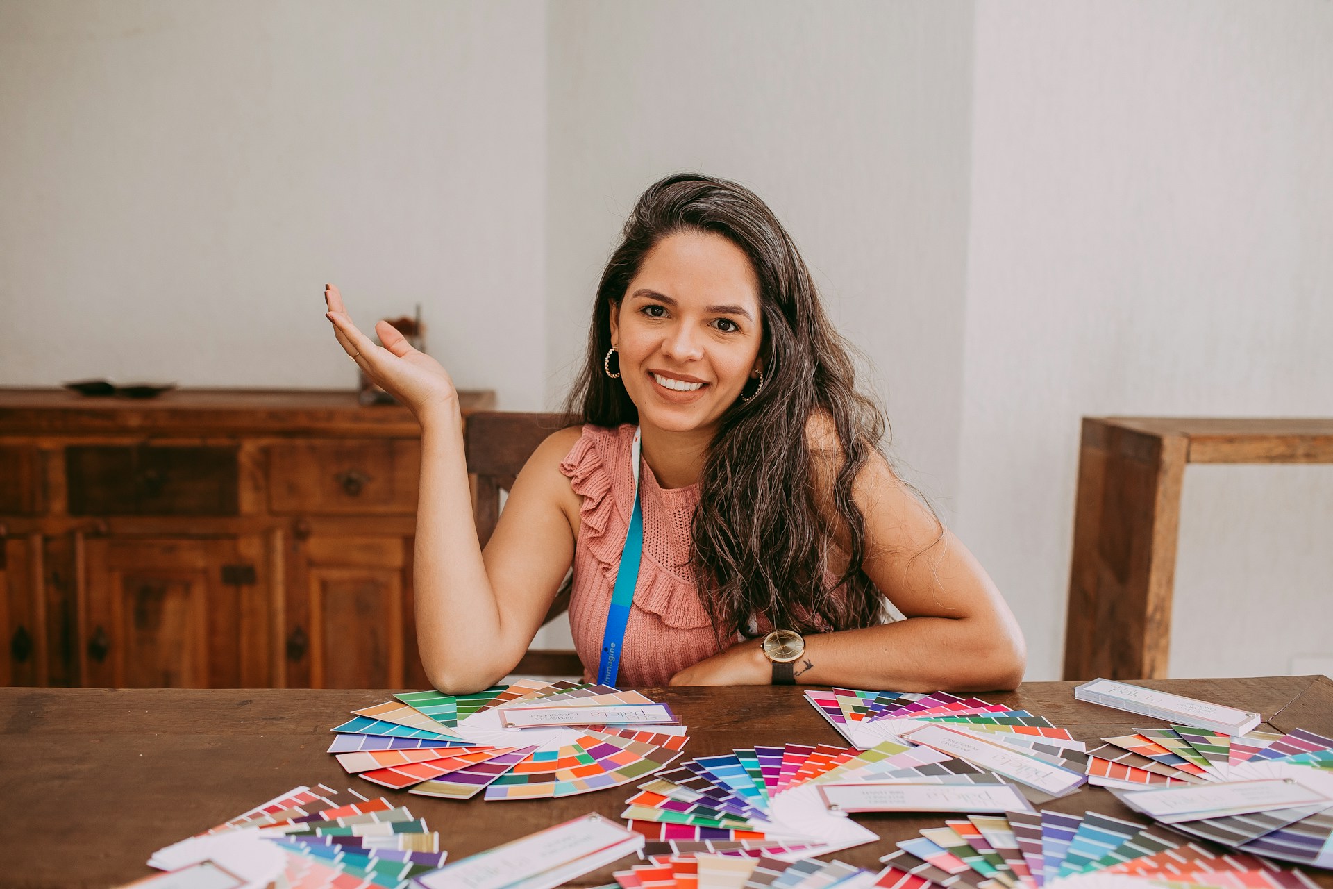 woman in blue and white tank top sitting on chair