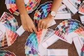 person holding white printer paper