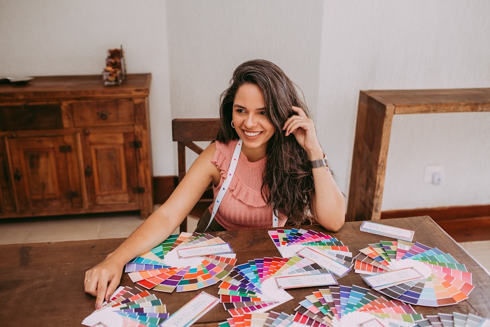 woman in white tank top sitting on chair