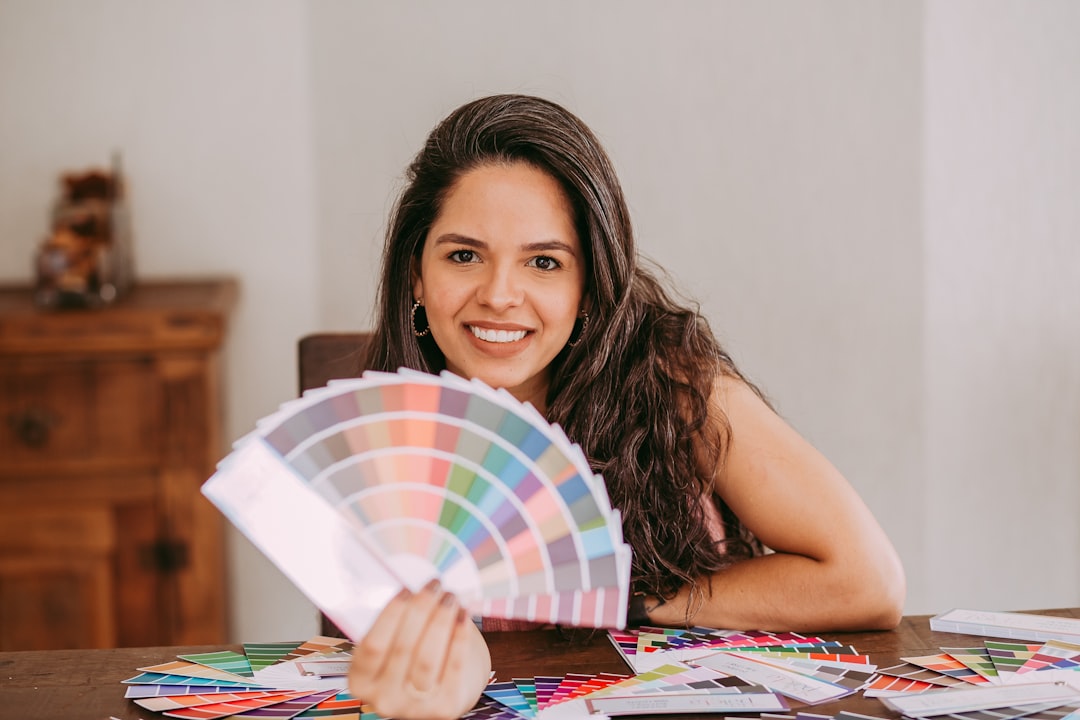 girl holding multi colored umbrella