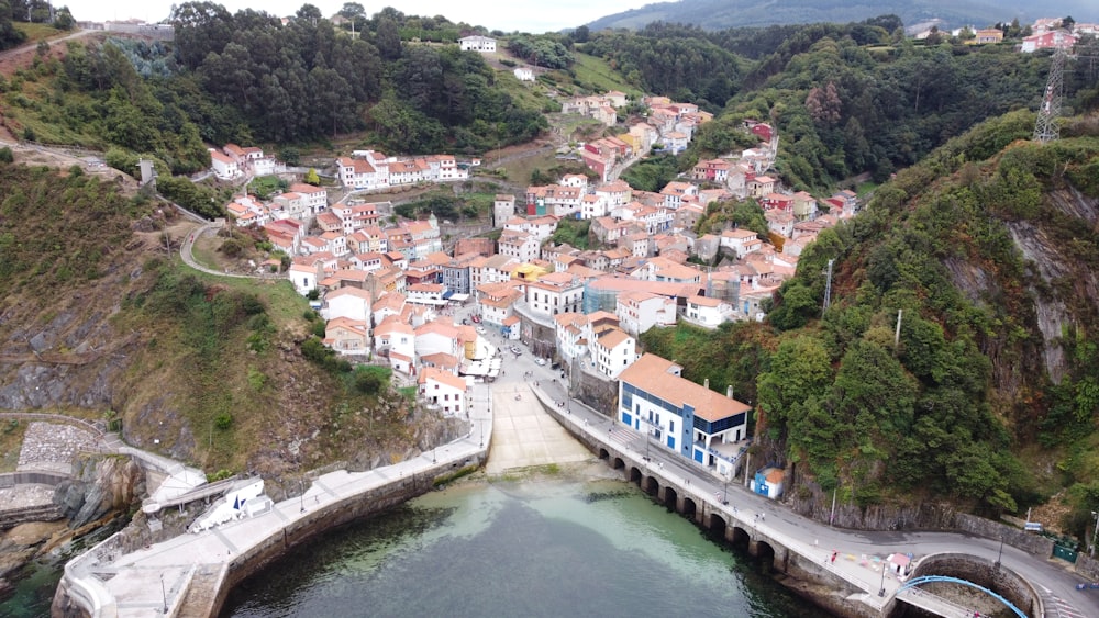 aerial view of city buildings near river during daytime