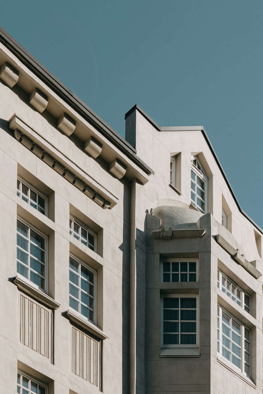 white concrete building under blue sky during daytime