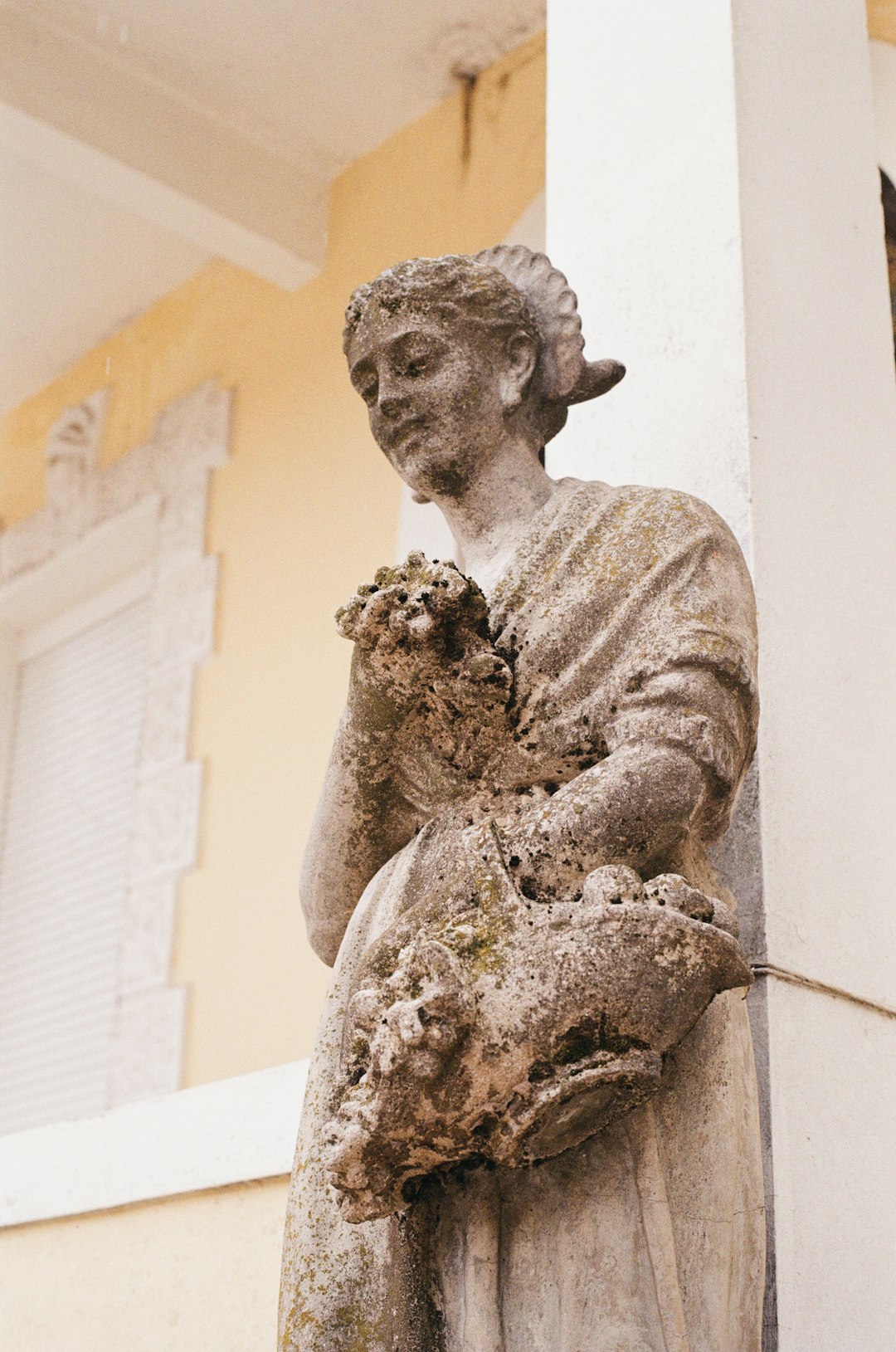 man with hat and hat statue