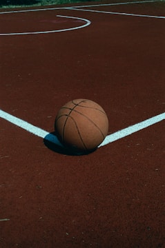 brown basketball on brown basketball court