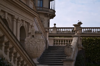a building with a staircase and a clock tower