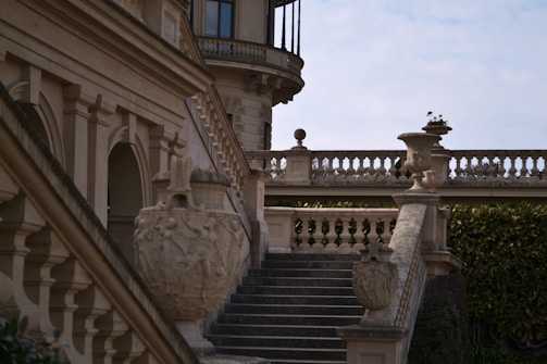 a building with a staircase and a clock tower