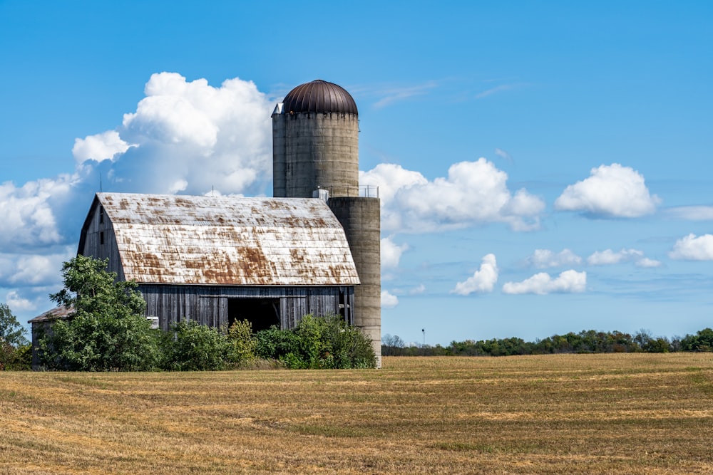 brown wooden barn under blue sky during daytime