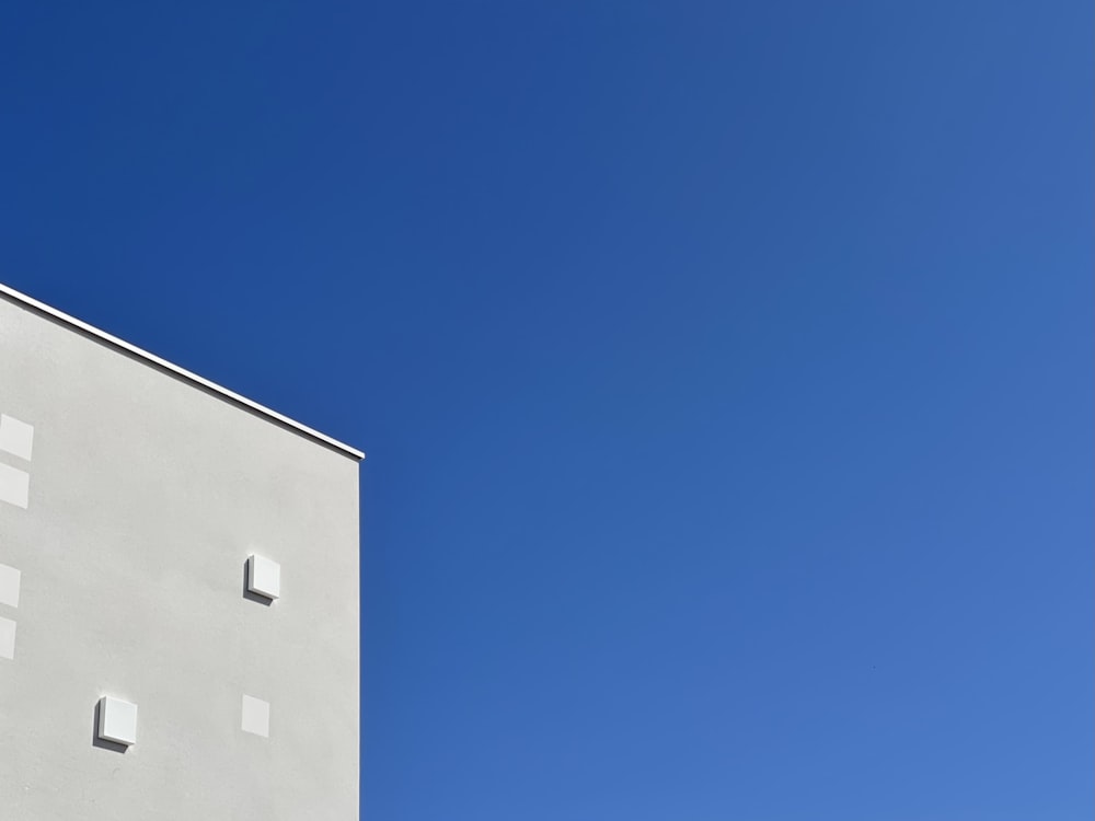 white concrete building under blue sky during daytime