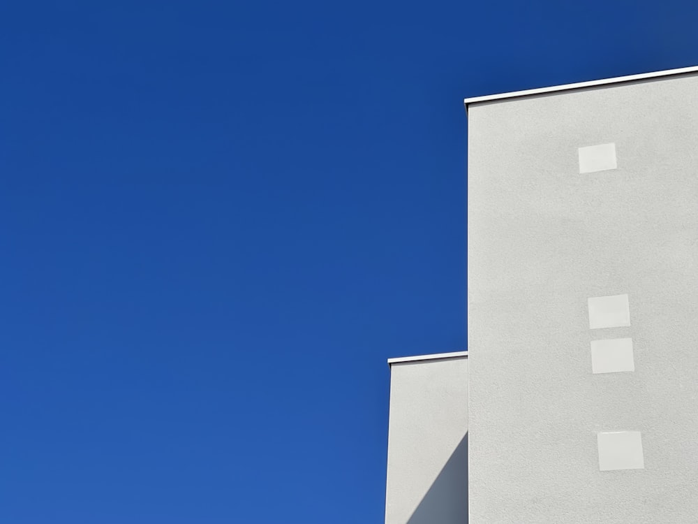 white concrete building under blue sky during daytime