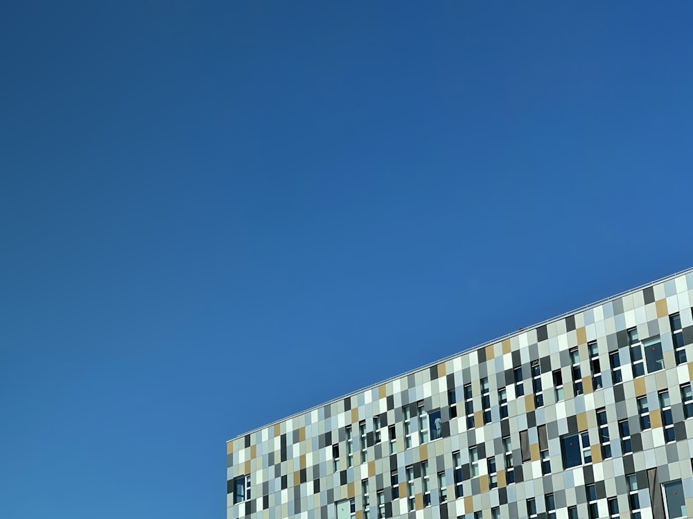 white and blue concrete building under blue sky during daytime