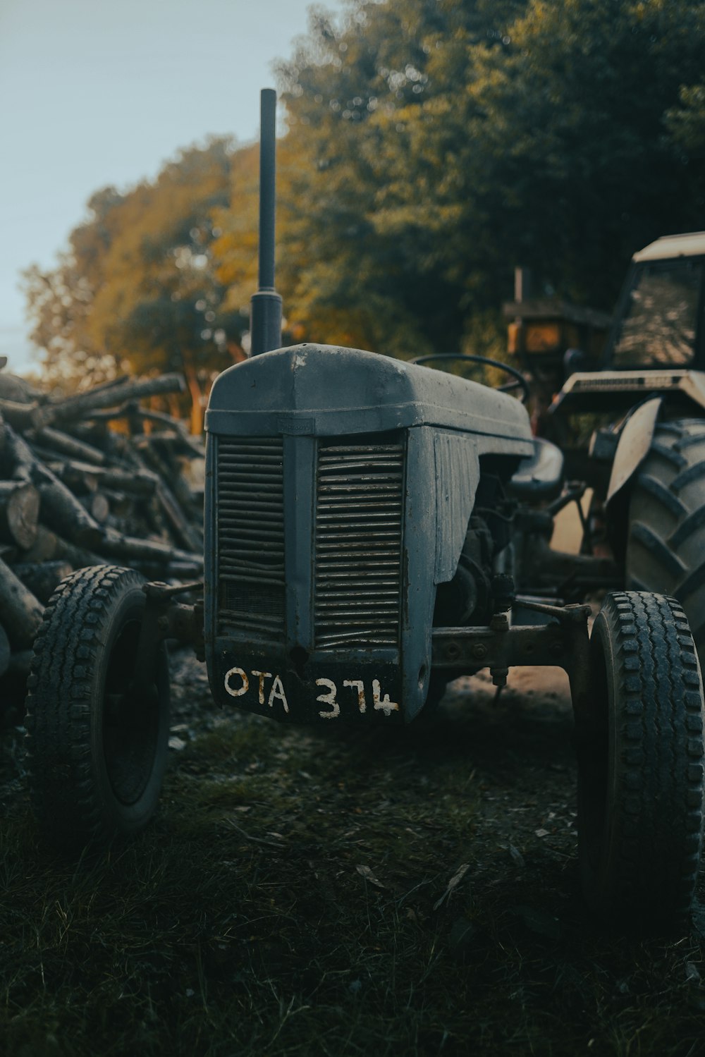 green tractor on green grass field during daytime