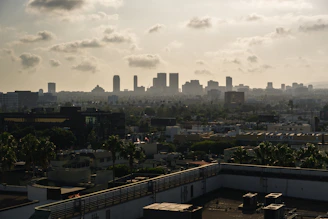 city buildings under white clouds during daytime